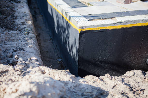 Professional Waterproofing technician working in Okemos, MI
